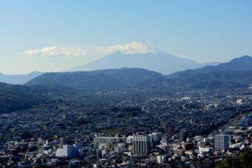 Mt. Fuji rises over the city of Hadano from Mt. Kobo Park