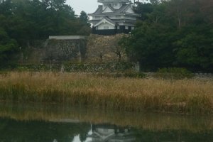 Yoshida Castle reflected in the Toyokawa river, a natural moat