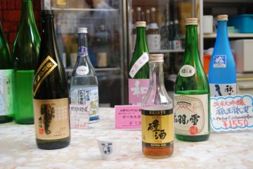 Sake bottles at the sampling corner. Your chance to taste the Dewa no yuki sake.