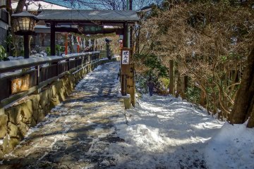 When leaving Mount Mitake you will pass this colorful shrine. To the right the snow covered trail connects to the neighboring Peak of Mount Hinode 