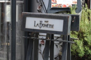 Outdoor sign for Cafe La Boheme
