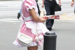 The girl inviting people to the "maid cafe" rather quietly
