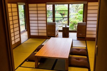 The tatami room looks through the engawa to the garden