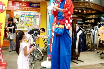 The lottery man wants to make your dreams come true at Juso Friendly Street just 10 minutes from Osaka Umeda