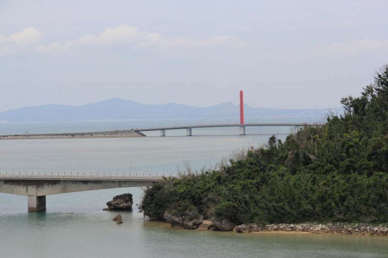 The Yakena Staits narrow passage only accomodates small recreational vessels; the bridge that connects Okinawa to neighboring Henza, Hamahiga, Miyagi and Ikei Islands is seen in the distance