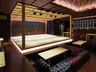 The centerpiece of Suigian, a warm, all-wood stage, a sacred space that appears to be floating. 