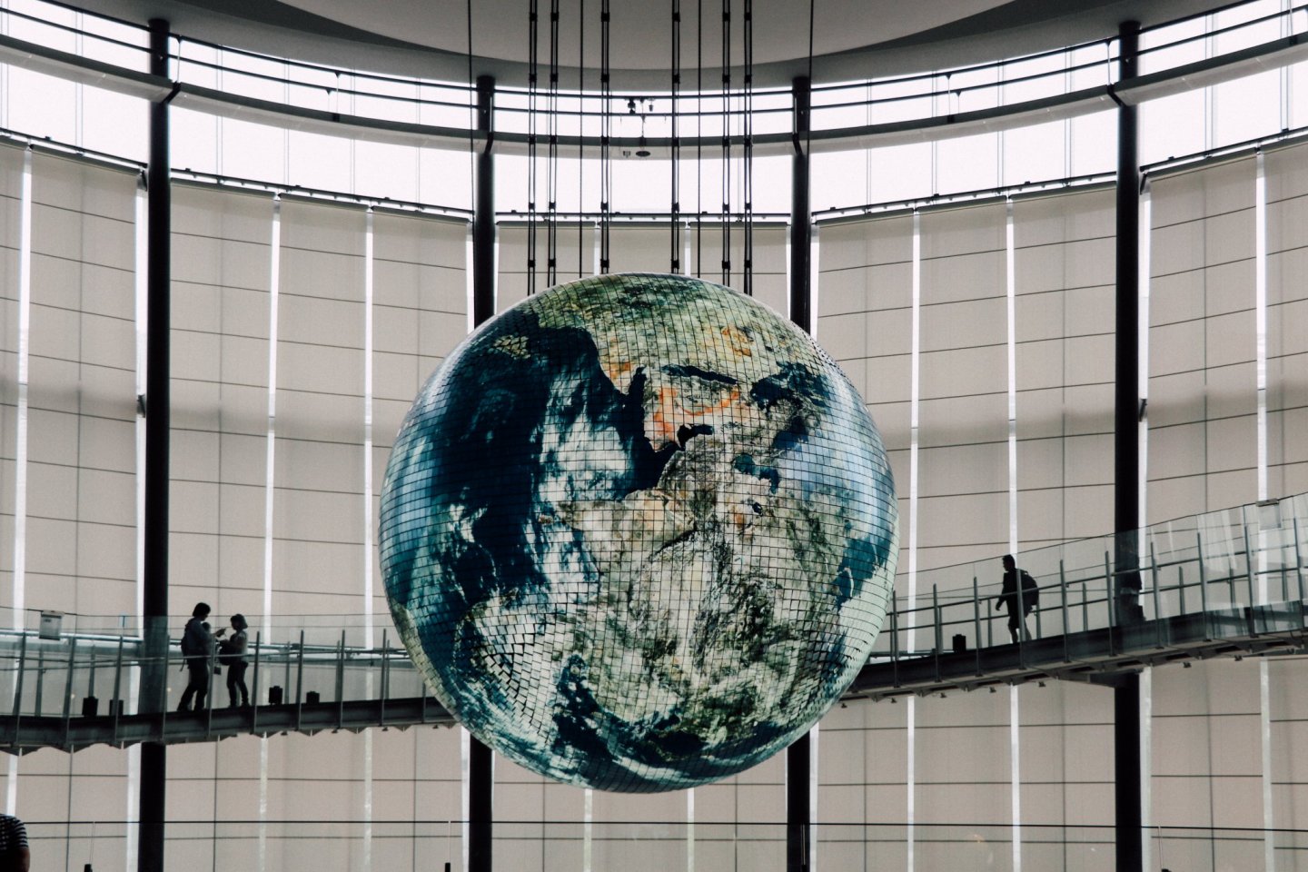 A huge globe hangs between levels 3 and 5 showing a week\'s worth of satellite and weather data.