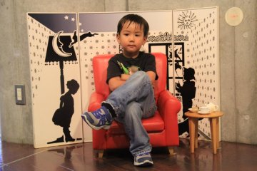 <p>There are unique photo opporunities like this tiny chair with props and backdrop, as well as an exact replica in gargantual proportion</p>