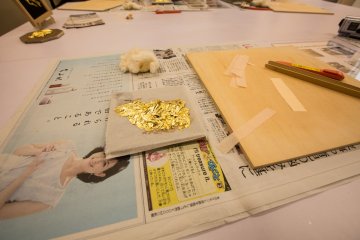 *Attempting* to coat the surface with the gold leaf. 