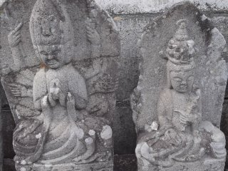 Venerable Buddhist figures by the gate