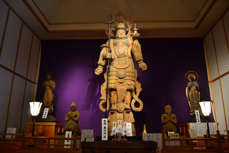 <p>The great Bishamonten with other old statues inside a new, purpose-built storage building. The statue itself is more than 1,000 years old and was carved from a single cypress tree.</p>
