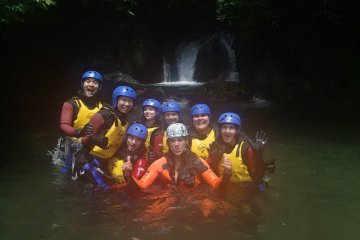 Feeling victorious after completing the canyoning course, we took a picture with our guide, Lee.