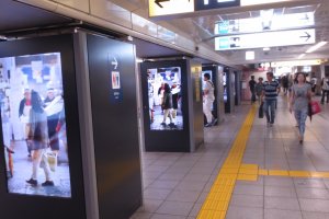 Video panels playing current commericials and ads for Tokyo Metro