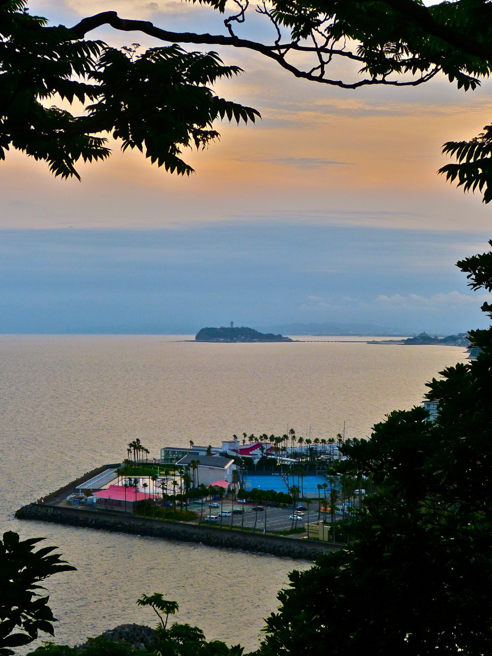 Zushi Marina with Enoshima Island in the background in the evening