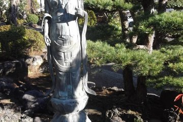A serene statue close to the worship hall