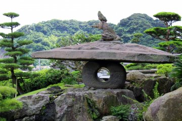 This is the Lion Stone Lantern, the largest lantern in the garden. Poised at the top of the lantern is a "shishi," an imaginary lion-like creature.