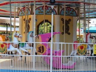 The colorful Mini Amusement area features a number of rides for small children.