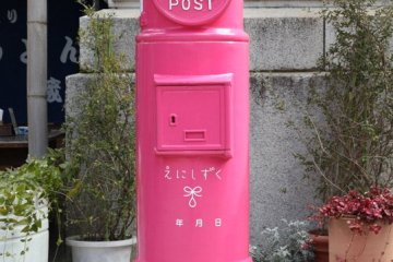 Take a picture with your partner or send them a post card from the pink post box at Karakoro Art Studio for good romantic luck