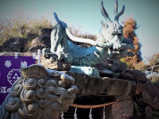 Some very serious characters watching over the Wadatsumi no Miya Dragon Shrine