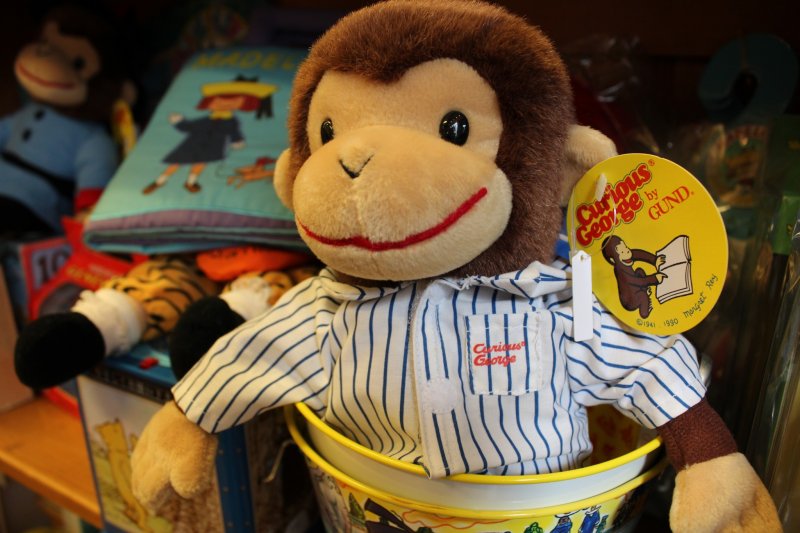 The back area of the restaurant is decorated in vintage-style toys including Curious George and Paddington Bear.