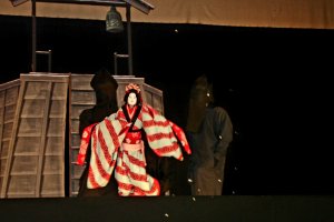 Bunraku puppet in action on stage