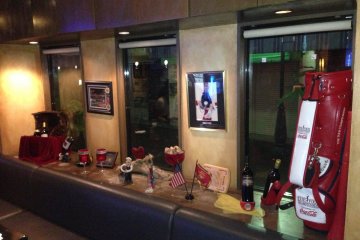<p>Sports decorations mix with bottles of wine on display in Sideways&#39; window</p>
