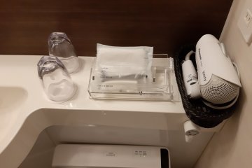 A fan and toiletries 