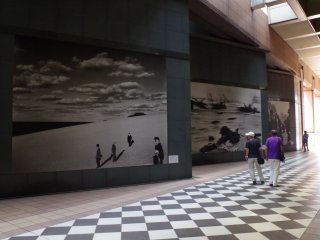 Corridor leading to the side entrance displaying the enlarged works of iconic photographs by local and international photographers