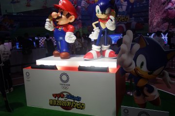 Mario and Sonic teaming up to compete.