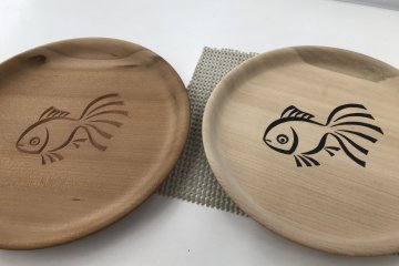 A completed plate alongside a plate waiting to be carved
