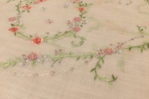 Fabric made in Japan, hand embroidered in Vietnam. Cotton woven to look like linen.