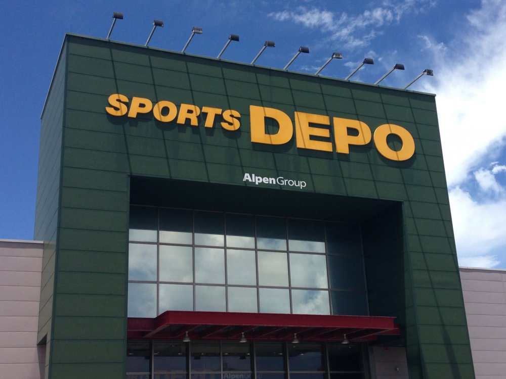 Sports Depo's large sign towers above its large warehouse style big box store underneath