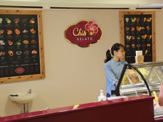 The colorful pictures on the faux chalkboard signs at Chibana Gelato show all of the flavors it offers, although only 10 are available at any given time