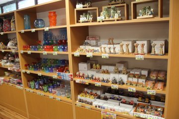 <p>There&#39;s a nice little selection of shisha dogs and Ryukyuan stained glass inside Partnerhip Shop and Cafe</p>