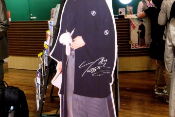 A life-sized photo of Yuzuru Hanyu in traditional clothing greets the guests of Sendai