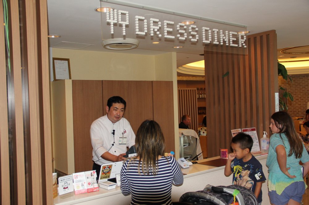 Pay at the entrance of the Dress Diner, then choose a table