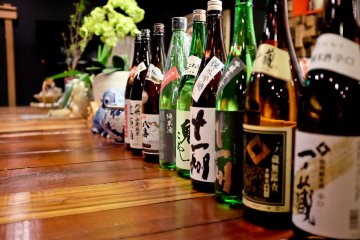 The counter is decorated with various Sake bottles in true Japanese style
