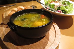 Seasonal Hokkaido vegetables showcased in a light soup, making it suitable for vegetarians