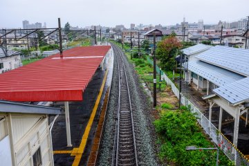 A view of Sembokucho Station from the overhead walkway with Morioka City in the distance