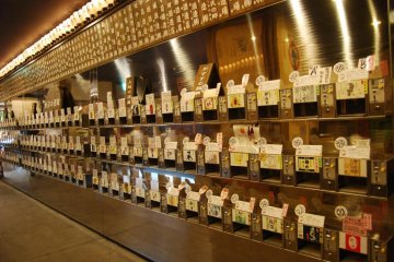 Row of sake mini vending machines at the Ponshukan