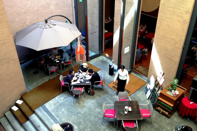 The Modern High Atrium Space at Cafe Cube is a pleasant place to rest in the summer heat