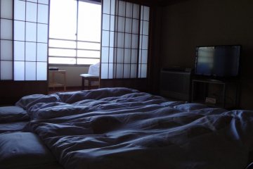 Enjoy sleeping on a real futon on a tatami mat and then waking up to a view of Mt. Fuji out your window!