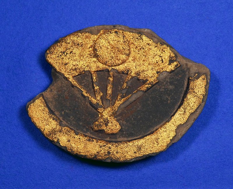 A gold leaf decorated item found at one excavation
