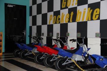 <p>The pocket-bikes aren&#39;t fast by street standards, but are a swift ride when navigating the oval arena on the fifth floor</p>