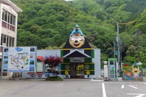 Awa-Kawaguchi Station features a smiling tanuki on the building