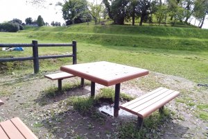 The park is suitable for a picnic on the spacious fields or this picnic table at the bottom of the kofun mound.