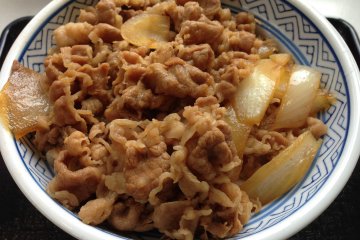 <p>Gyudon is a donburi dish of rice covered by beef and onions</p>