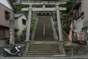 The Torii separates houses and marks the beginning of the short climb up the mountain