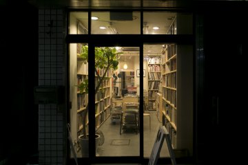 The warm inviting glow of the bookstore at night, just moments from Yoyogi Hachiman Subway Station