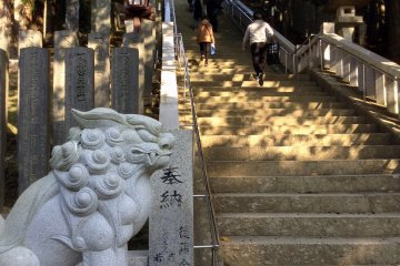 Stairs leading up to the main shrine are protected by demon guardians.